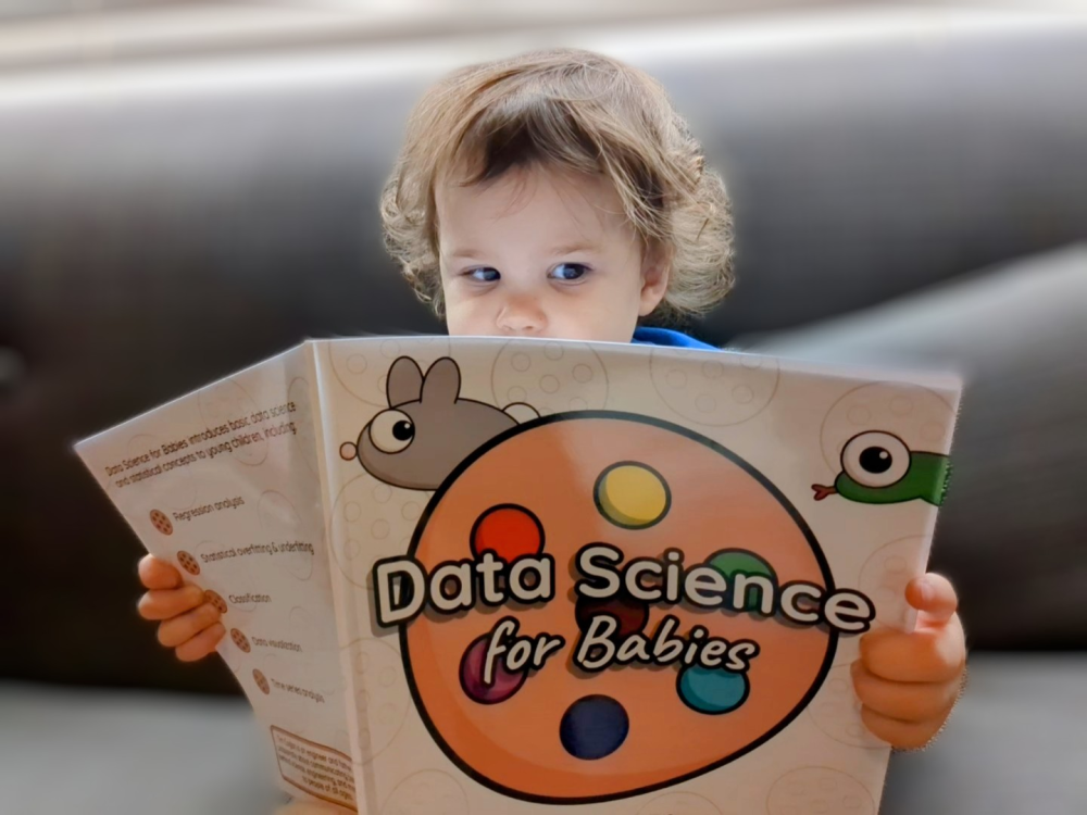 Toddler reading Data Science for Babies